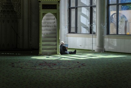 A man inside a mosque worshiping God